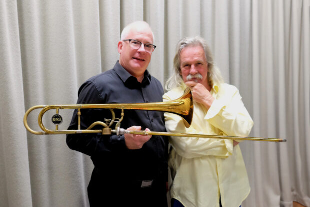 Gregory Van der Struik holding trombone with Alan Holley composer